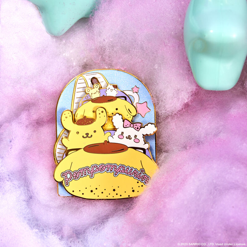 Image of our 3" Pompompurin Carnival Sliding Pin against a fluffy pink and purple and teal background, featuring Pompompurin, Macaroon, Muffin, and Scone on a roller coaster